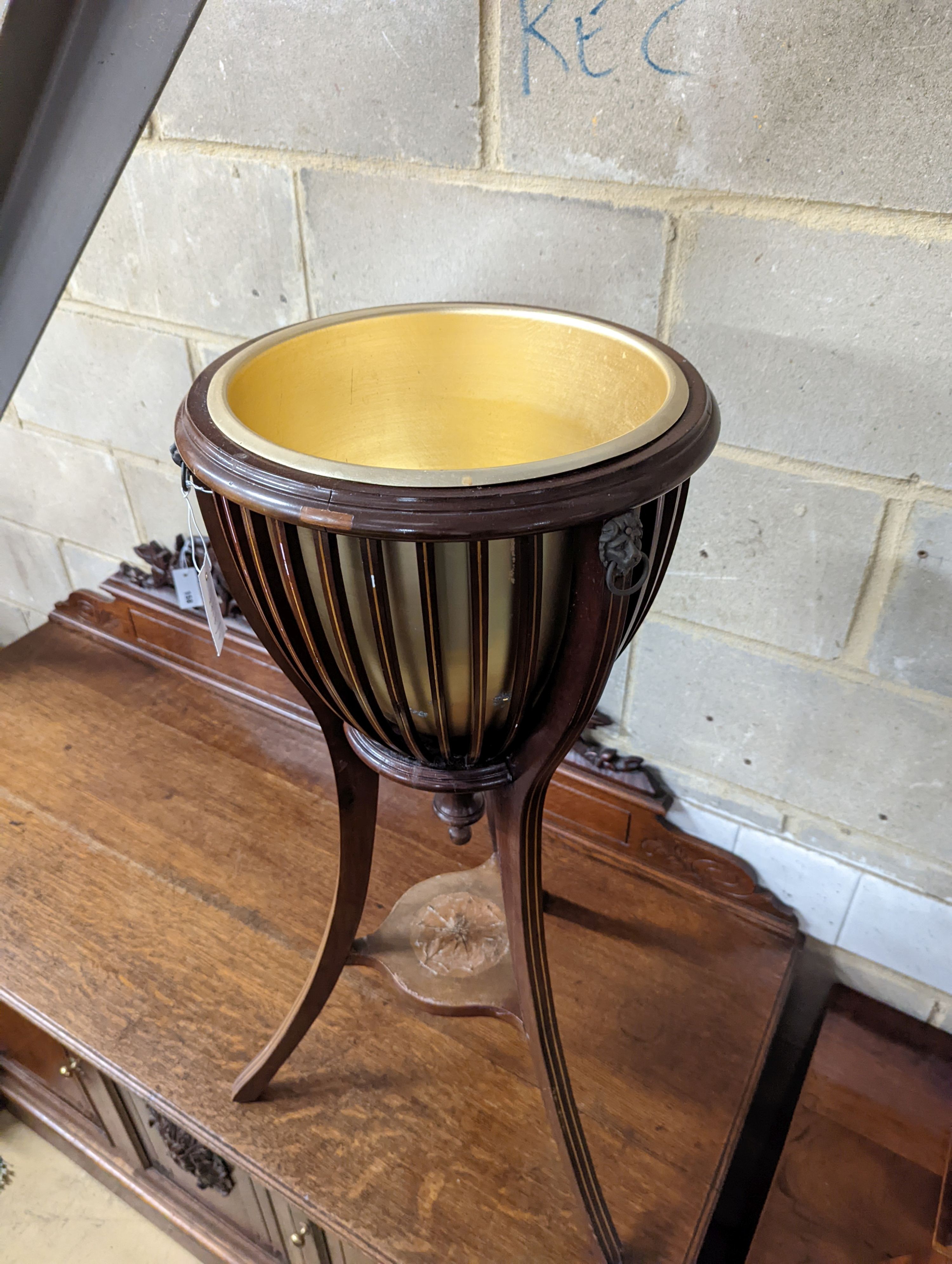 An Edwardian style inlaid mahogany jardiniere, height 85cm